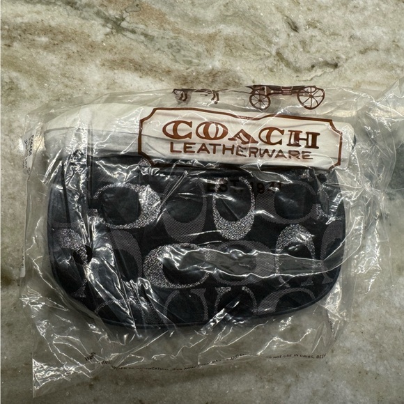 NWT!! Coach wristlet, still in packaging!! Black, silver, and grey. Smoke free - Picture 2 of 9